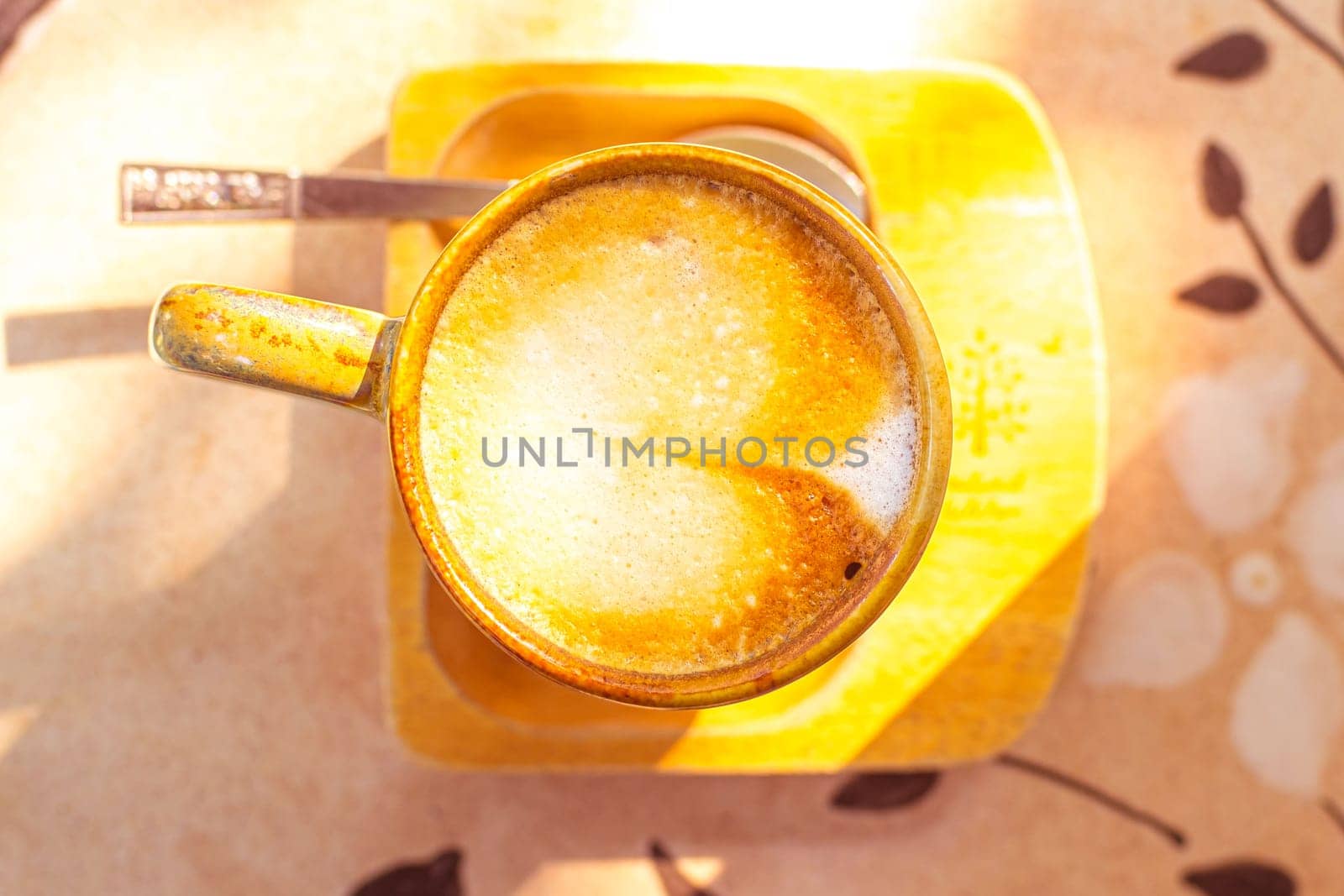 coffee, books on table in summer garden. Rest in garden, reading books, breakfast, vacations in nature concept. Summertime in garden on backyard