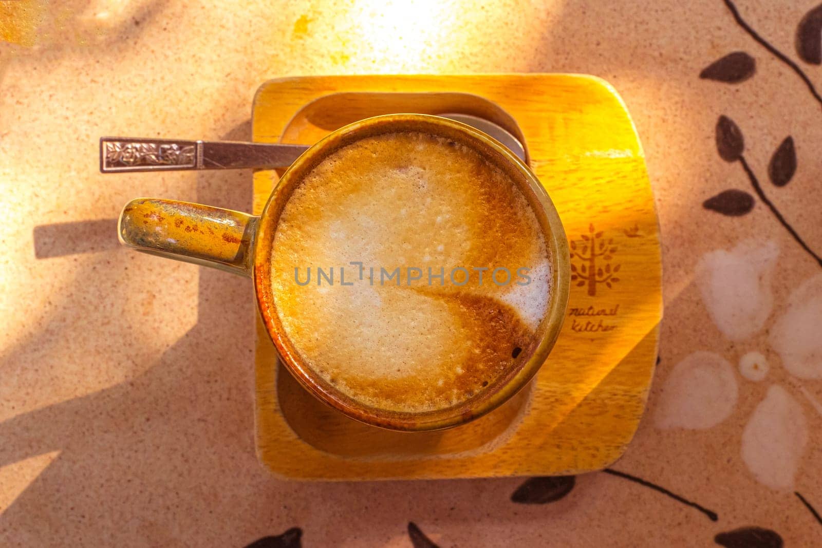 coffee, books on table in summer garden. Rest in garden, reading books, breakfast, vacations in nature concept. Summertime in garden on backyard by Petrichor