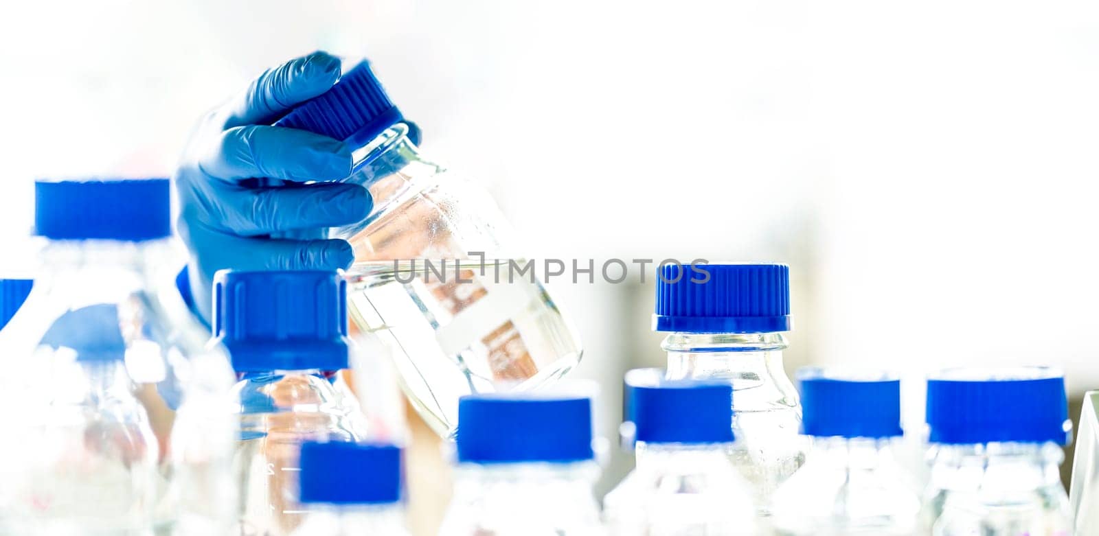 glass containers and bottles for the research of chemical substances in the laboratory. High quality photo