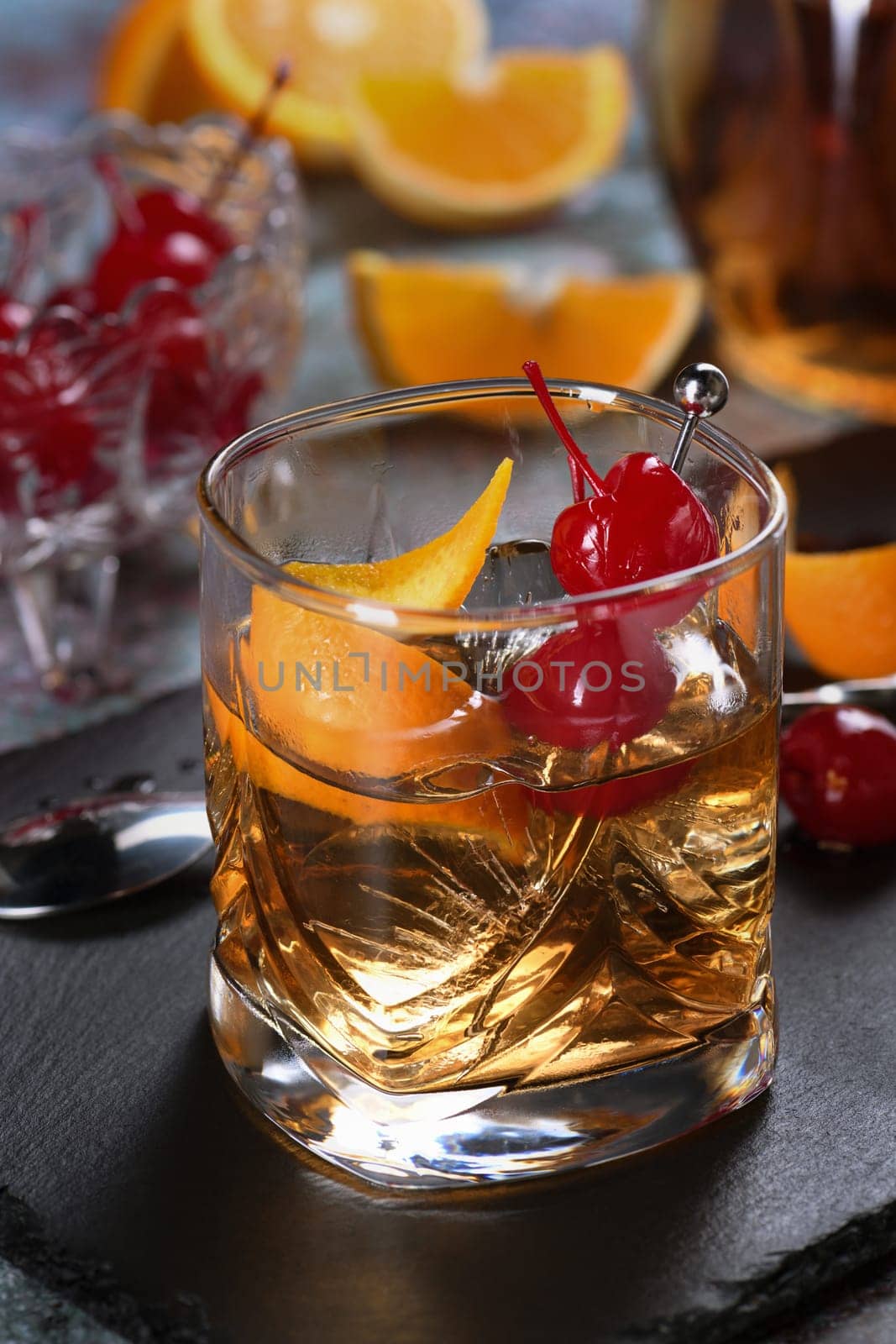 The Irish redhead. The cocktail is made from whiskey, grenadine syrup, soda water, lemon or lime juice, garnished with cherry garnish and orange zest, served in a scotch class with ice. An ideal aperitif before dinner.