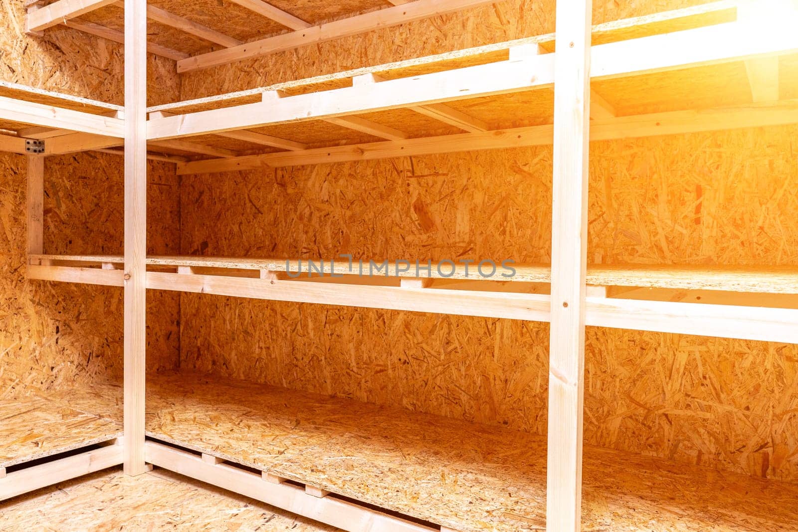 OSB racks, shelves are designed for storing things. Dressing room in the house. Organization of spaces in the house. Shelves in the garage