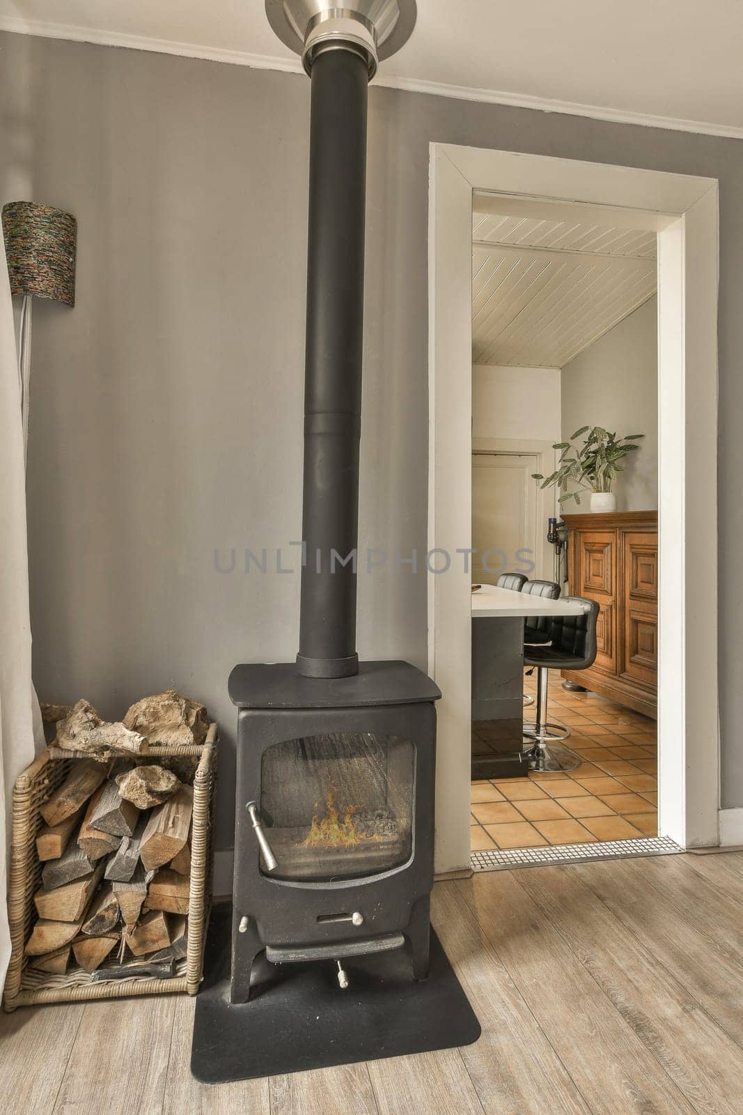 a wood burning stove in a living room by casamedia