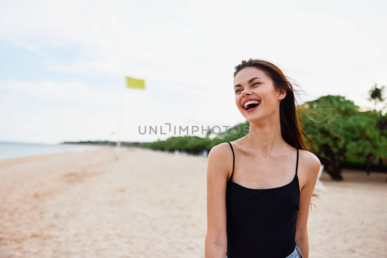 woman nature tropical free person summer sand girl smile vacation caucasian relax walk ocean sun sea coast female young beach copy-space