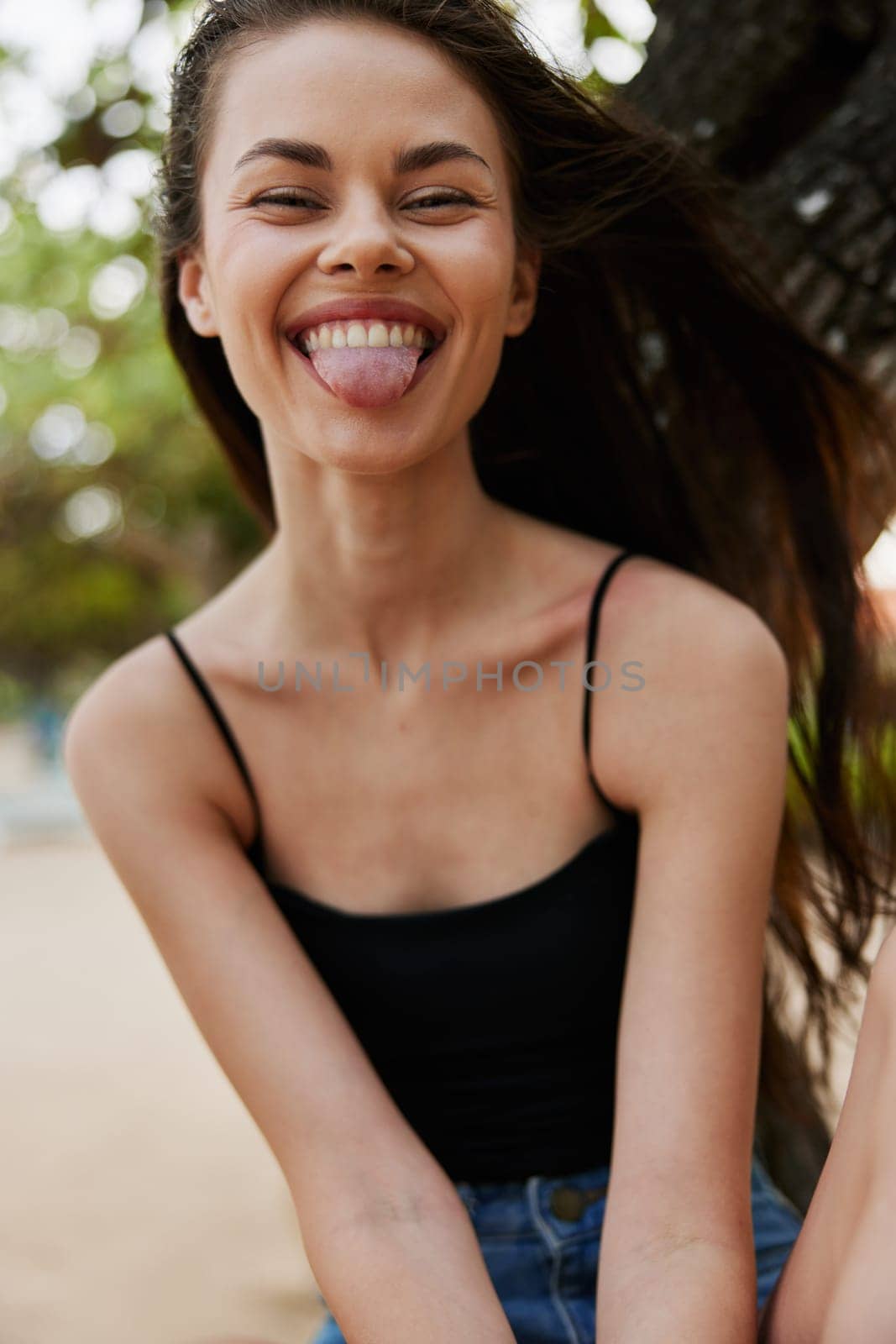 sky woman lifestyle sitting nature tree smiling tongue hair long sea vacation by SHOTPRIME