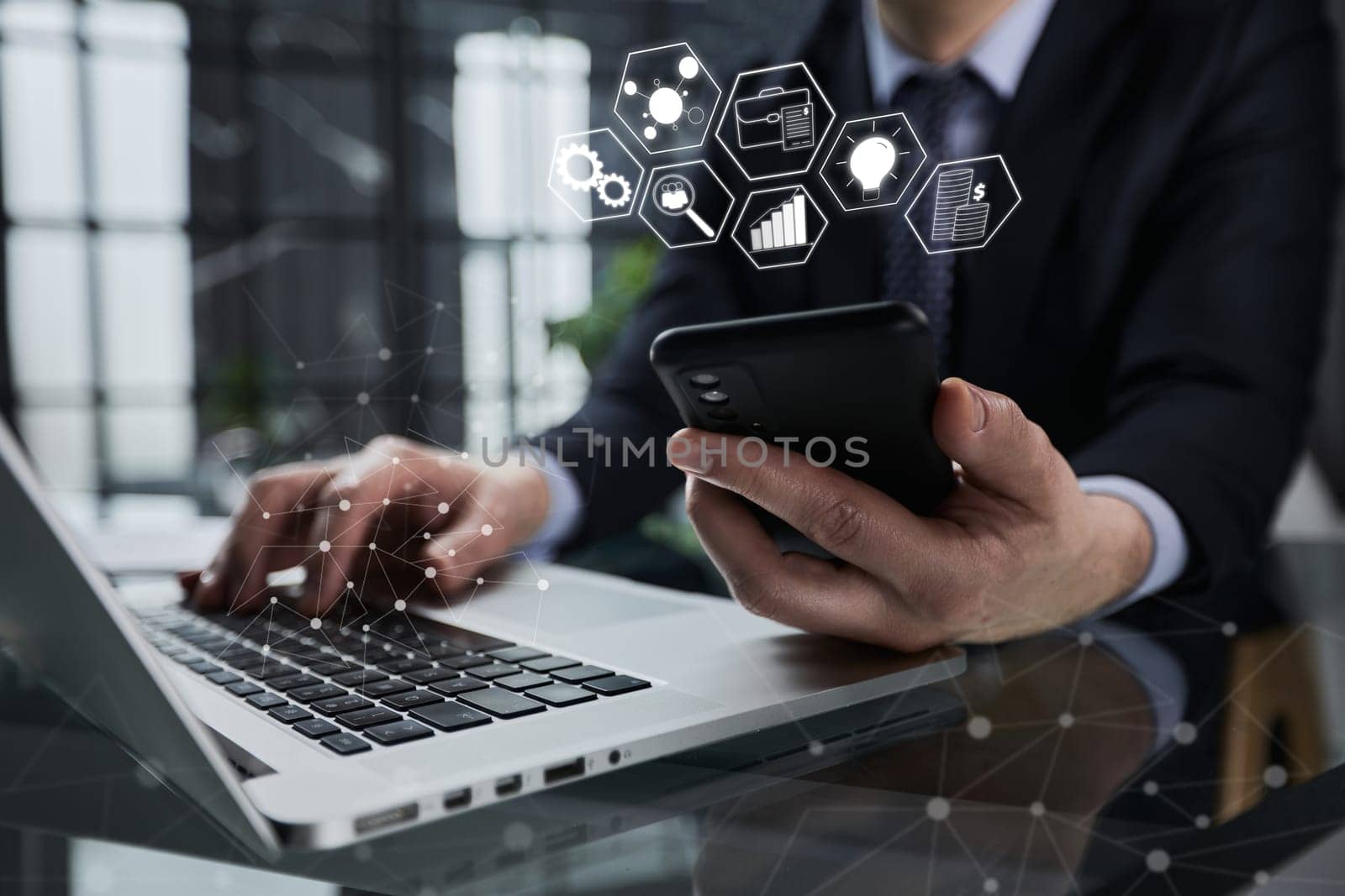 Side view shot of a man's hands using smart phone in interior,