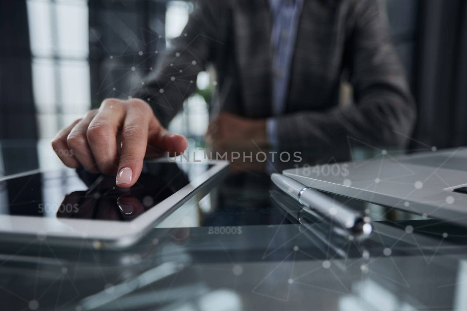 businessman pressing his finger on the screen of the digital tab