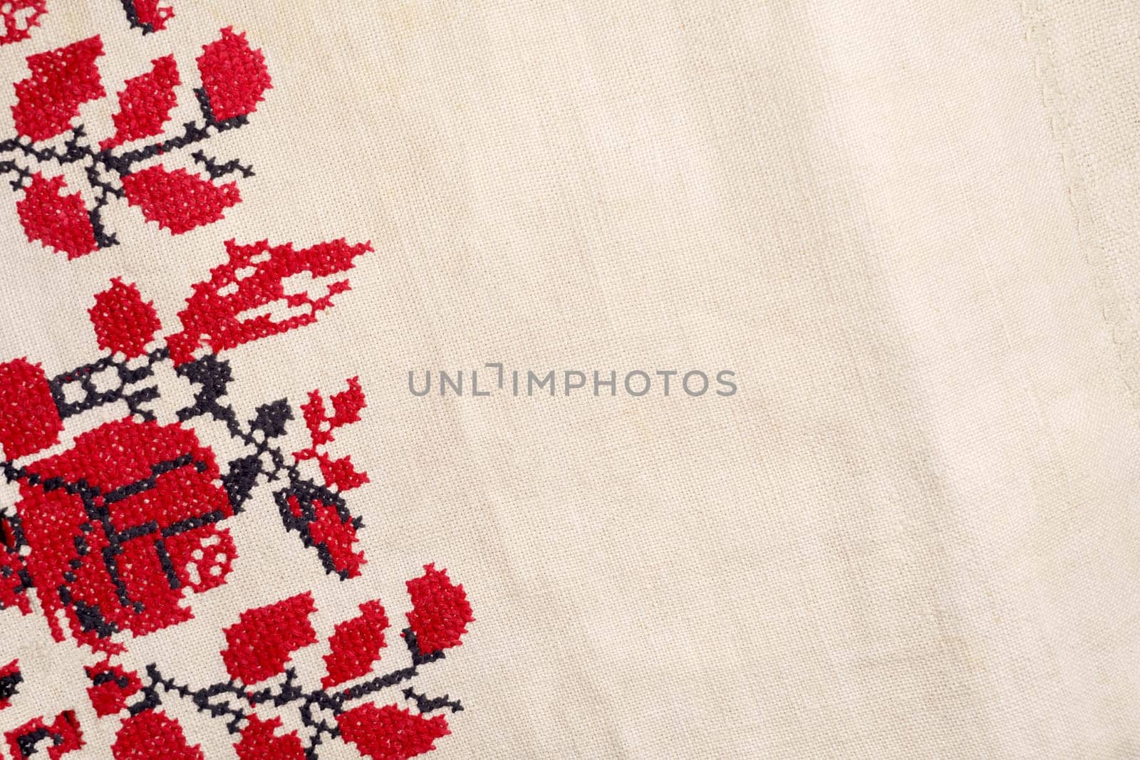 Embroidered good like old handmade cross-stitch ethnic Ukraine pattern. Ukrainian rushnyk . Red version over white background. Beige white farmhouse style stripes texture. Woven linen cloth pattern background. Line striped closeup weave fabric for kitchen towel material. Pinstripe fiber picnic table cloth . Black and red embroidery. by aprilphoto