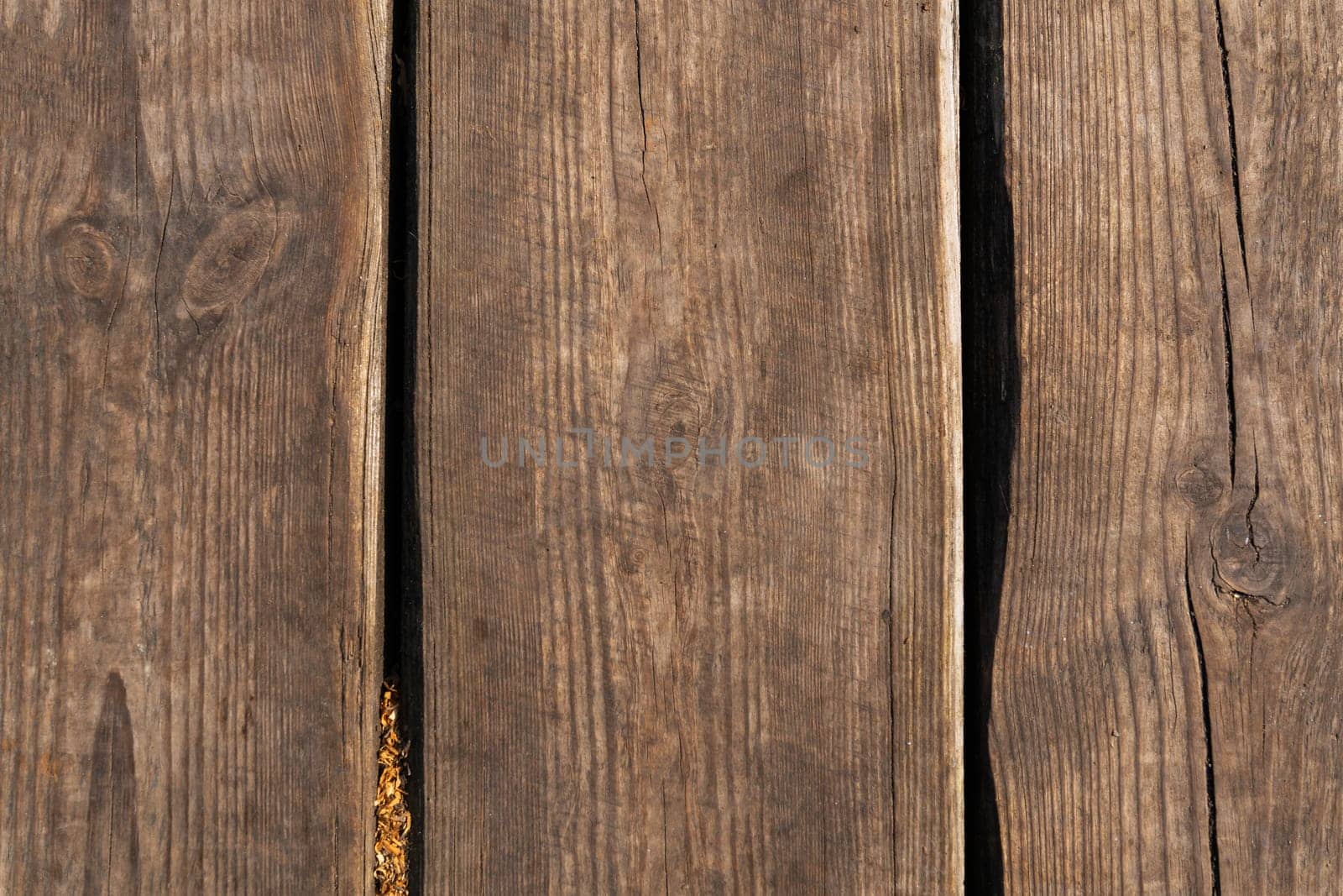 Brown scratched wood texture, old background, wooden planks. Old wood texture, close-up