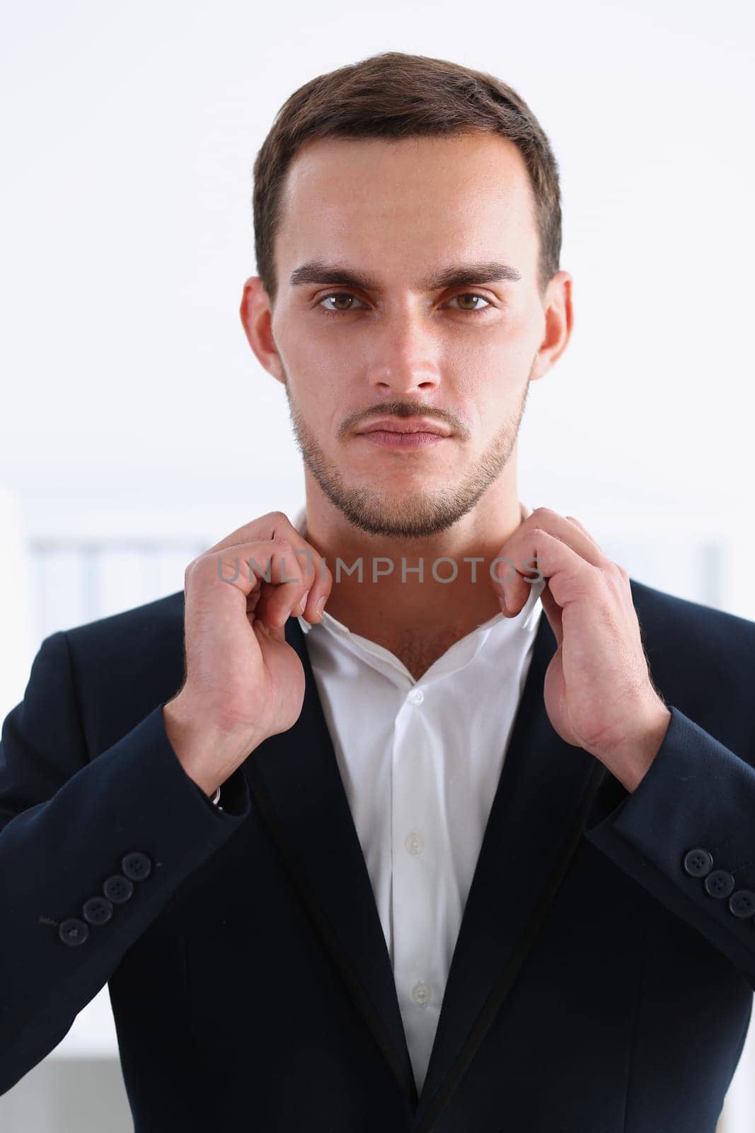 Handsome man in suit and tie look in camera hands crossed on chest background. White collar dress code modern office lifestyle graduate college study profession idea coach train concept