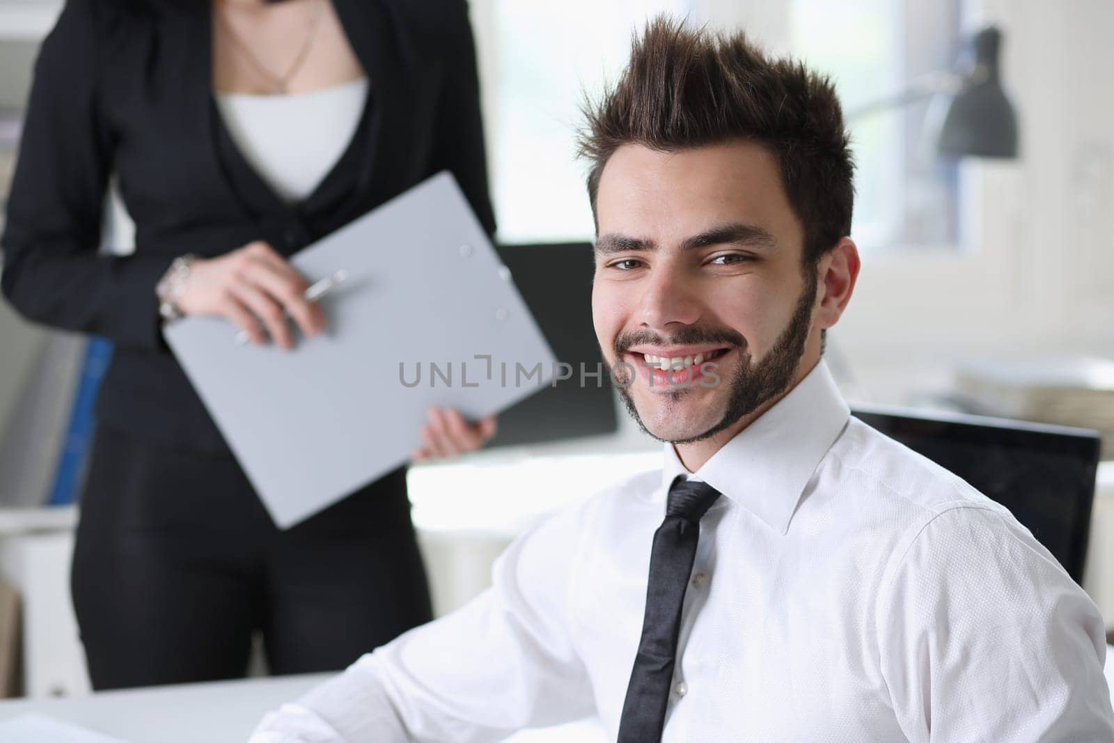 Portrait of handsome man work at office with assistant