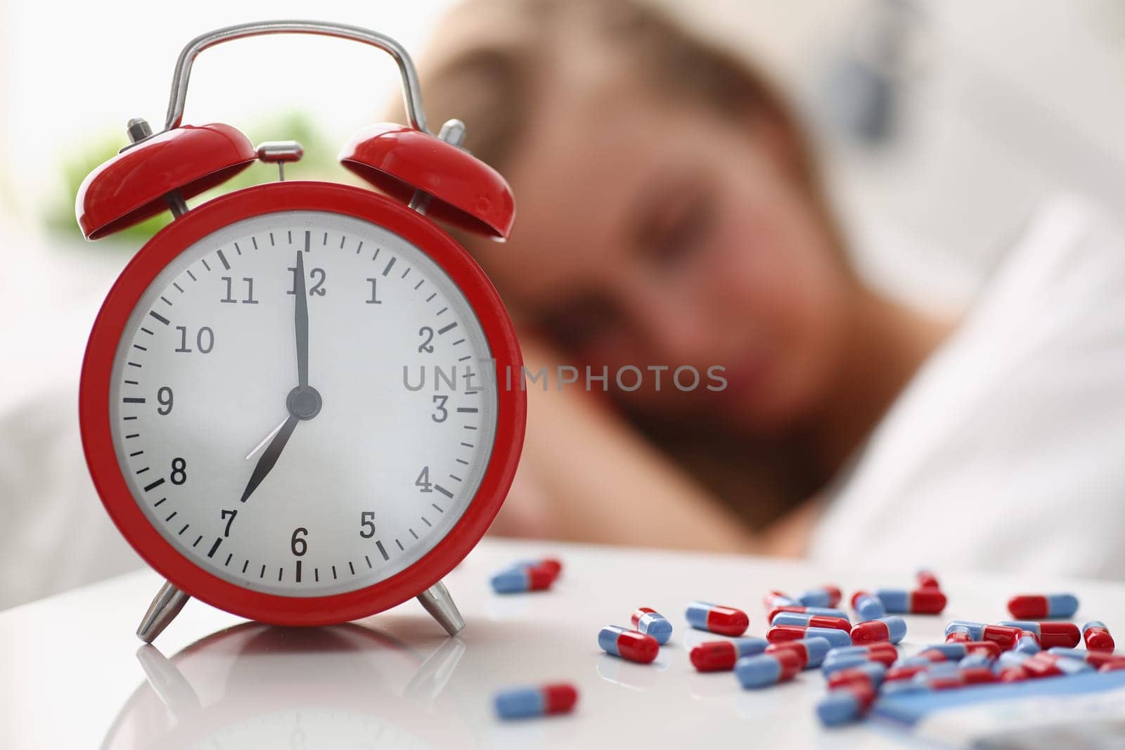 woman is ill take drugs sleep in bed by kuprevich