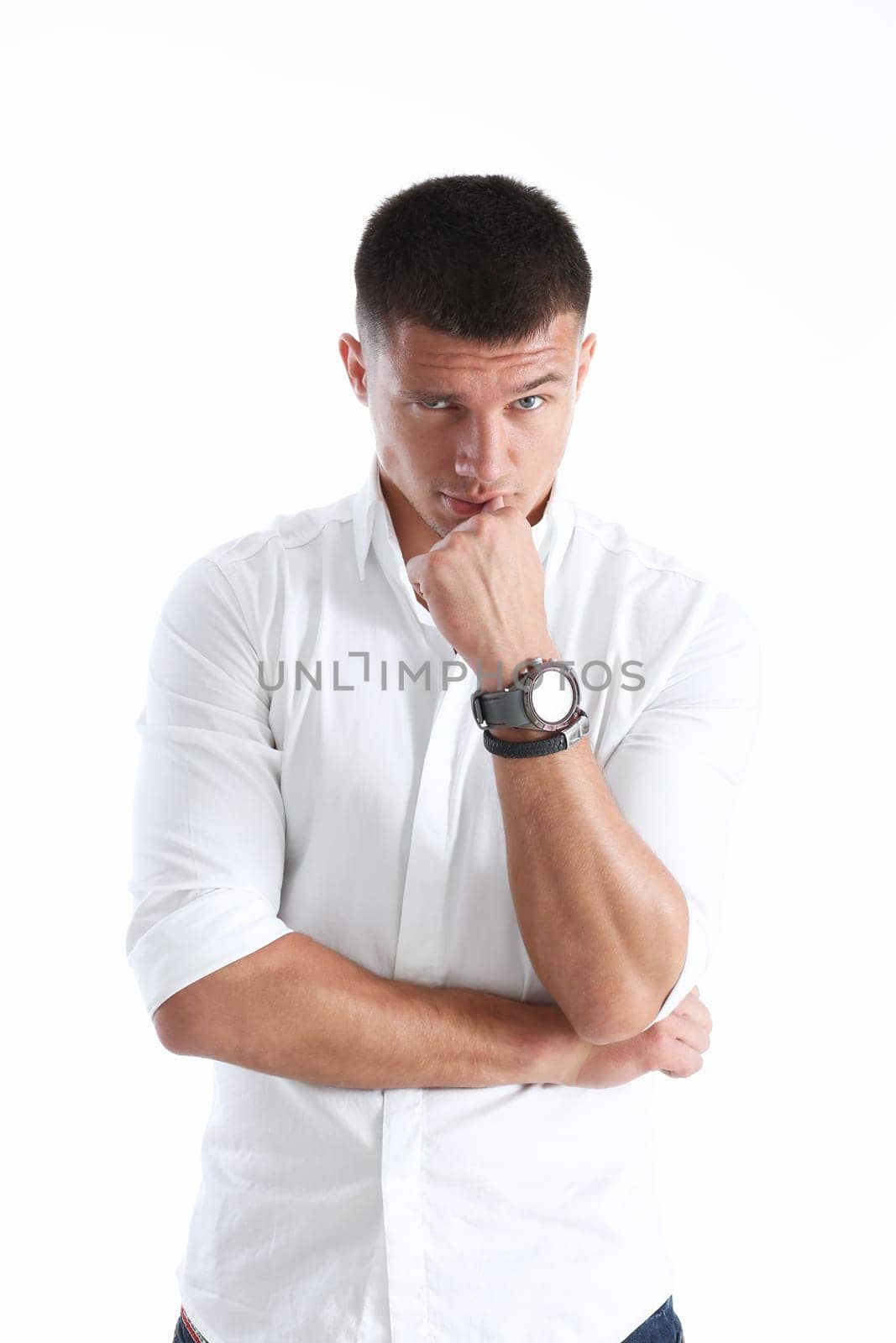 Young successful businessman on a white background in a shirt