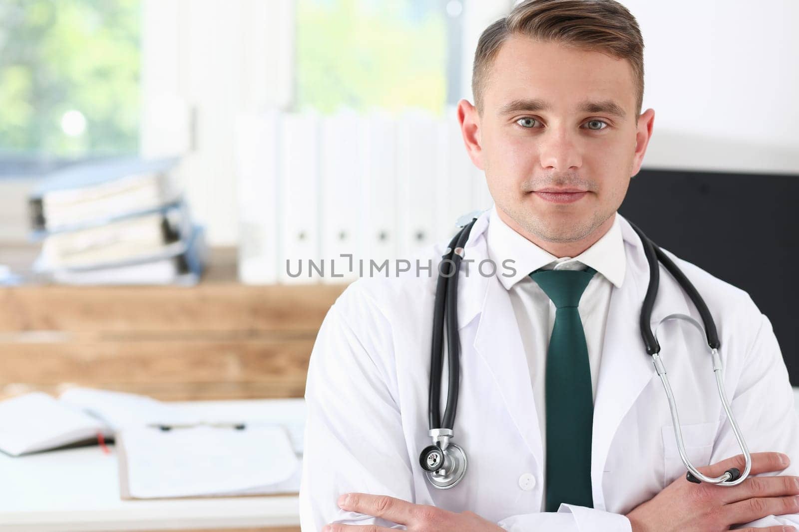 Male medicine doctor his chest in office by kuprevich