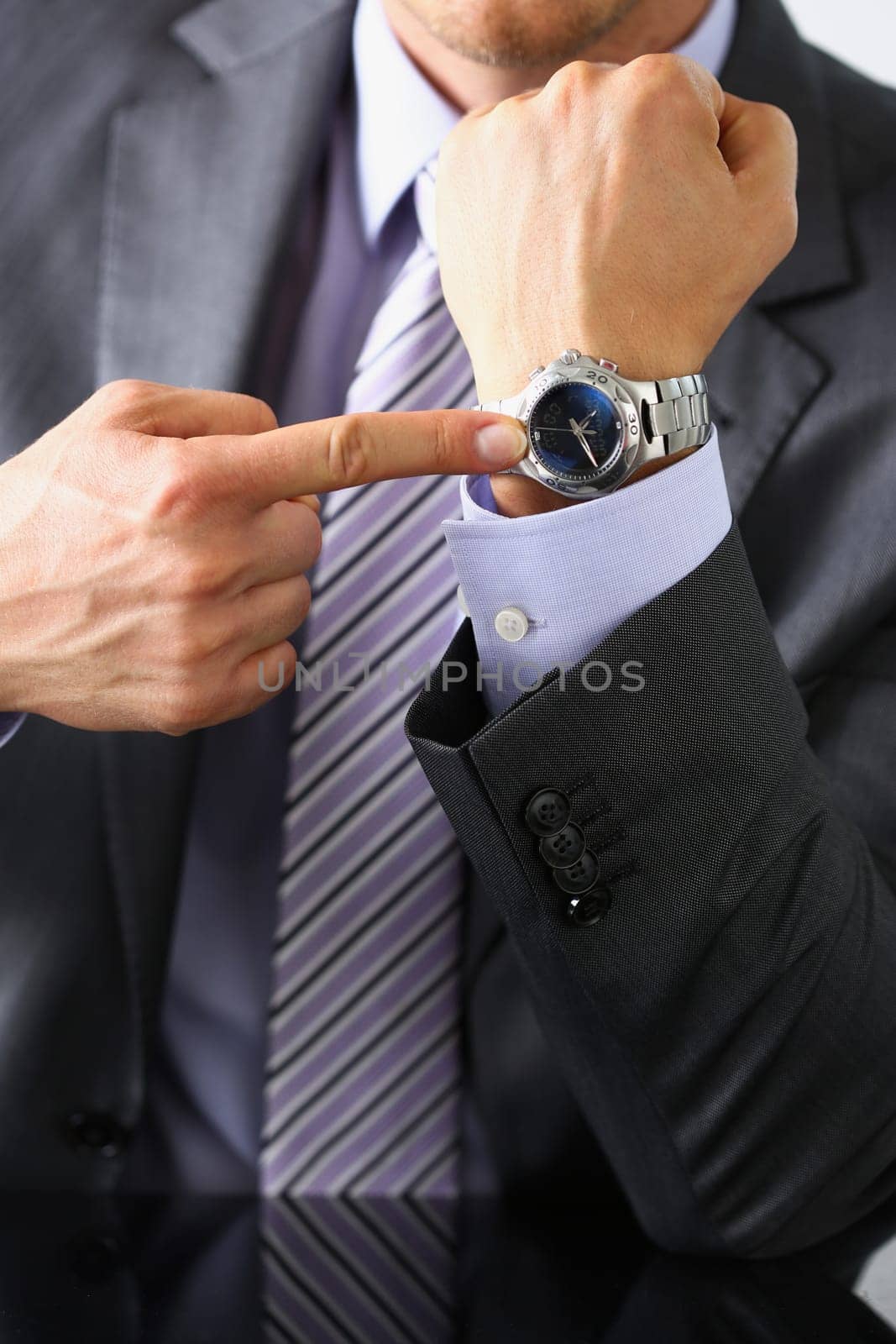 Man in suit and tie check out time by kuprevich