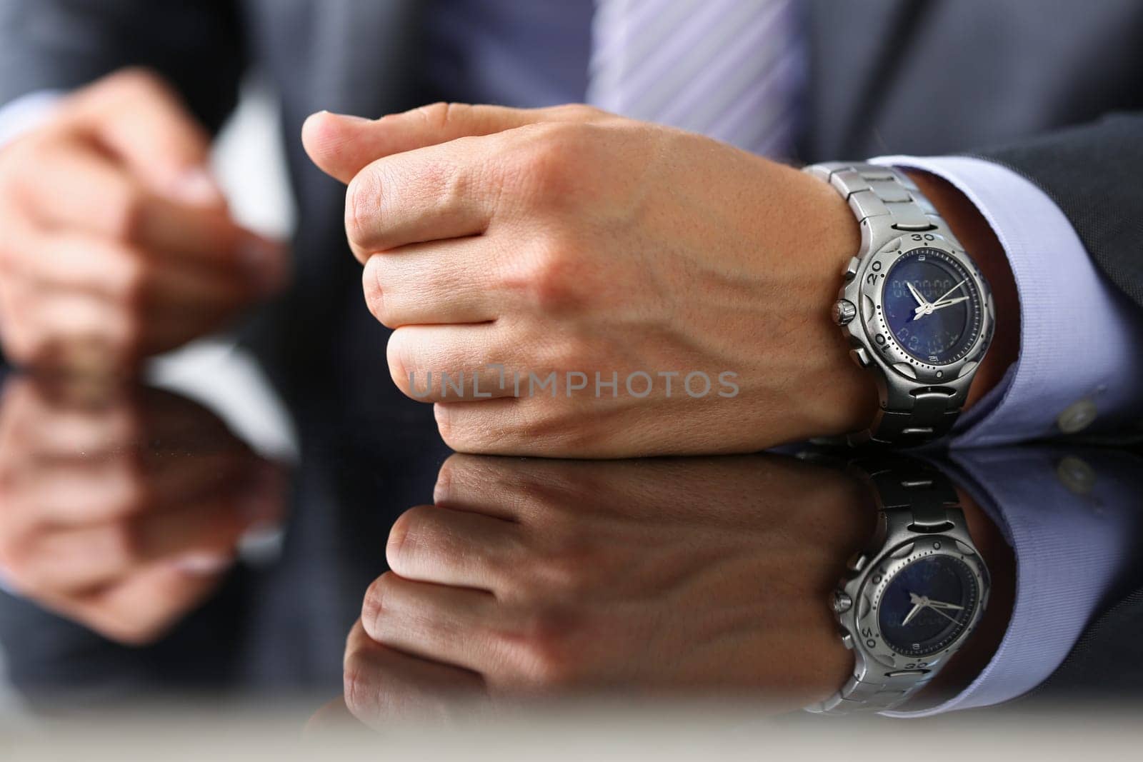 Man in suit and tie check out time at silver wristwatch closeup. Waste minute modern punctual life style start hurry job idea last second clockwork precision concept