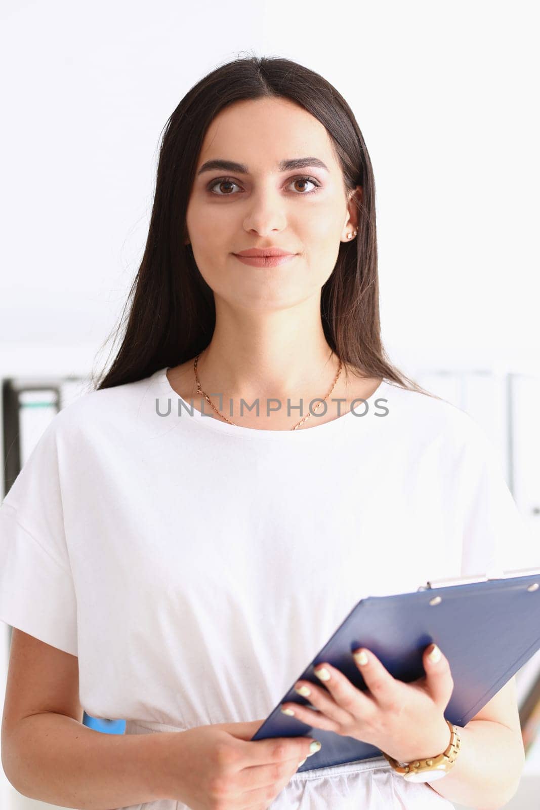 Indian woman worker portrait holding clipboard by kuprevich