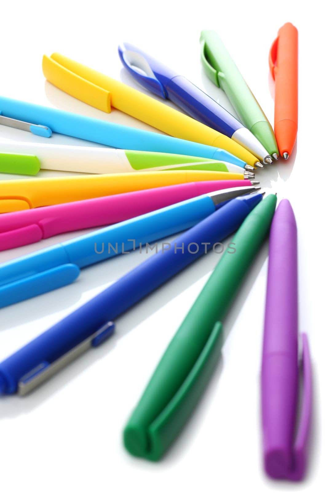 Multicolored ball point pens isolated on white background