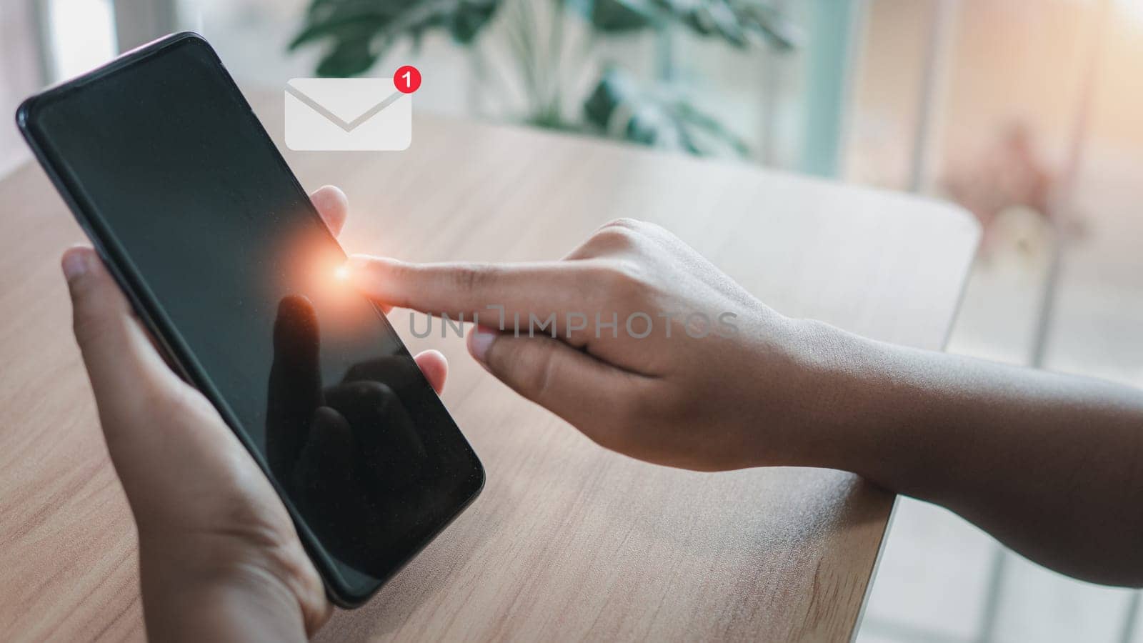 Human hand touching email on virtual screen. New email notification concept for business email communication and digital marketing. The inbox receives electronic message notifications. internet technology by Unimages2527