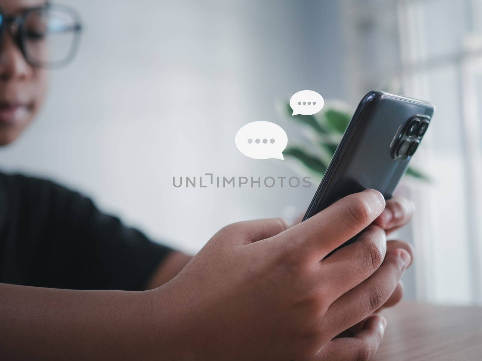 boy hand using smartphone typing live chat chatting on application communication digital web and social network concept. Social media application chat box. by Unimages2527