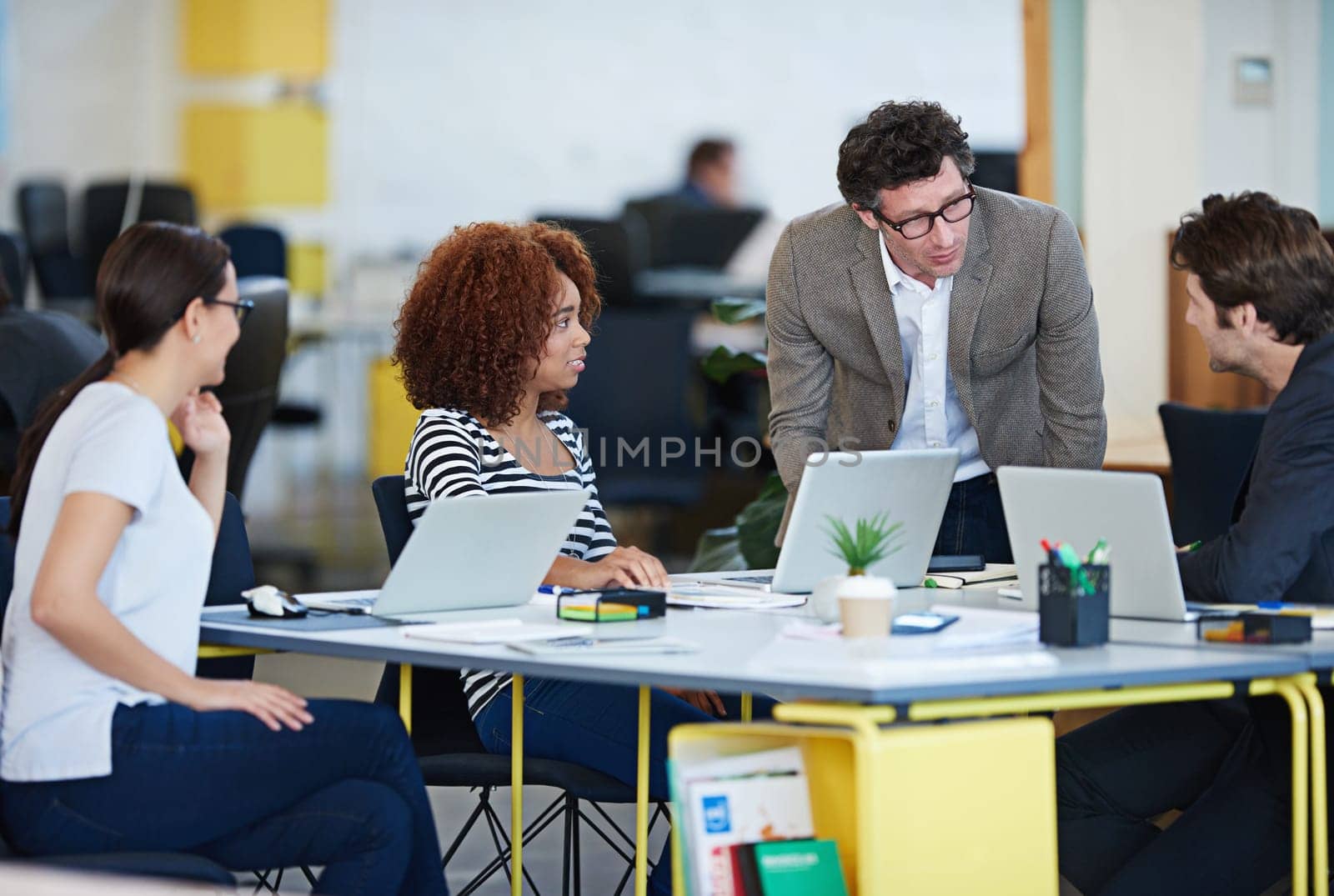 Theyll get the project done. business people around a table