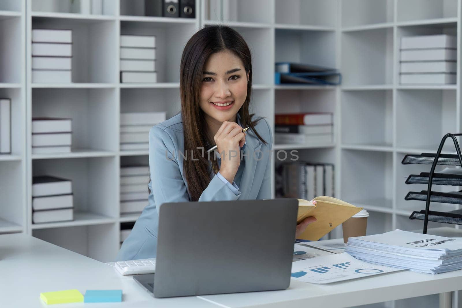 Business woman company success in a corporate office happy with her professional career.