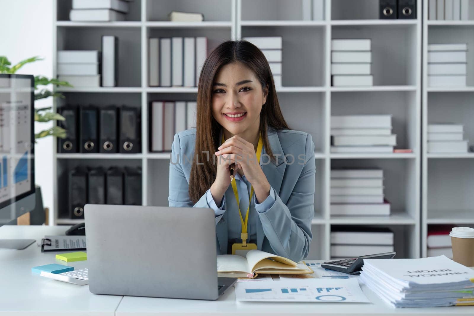 Business woman company success in a corporate office happy with her professional career.