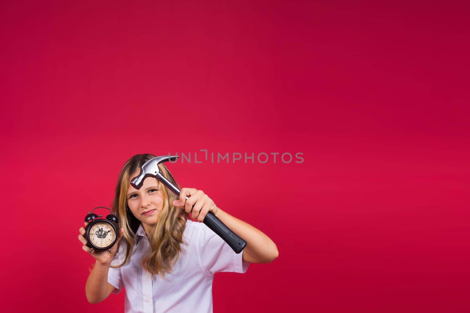 Kid girl holding hammer and alarm clock smiling with a happy and cool smile on face. showing teeth. by Zelenin