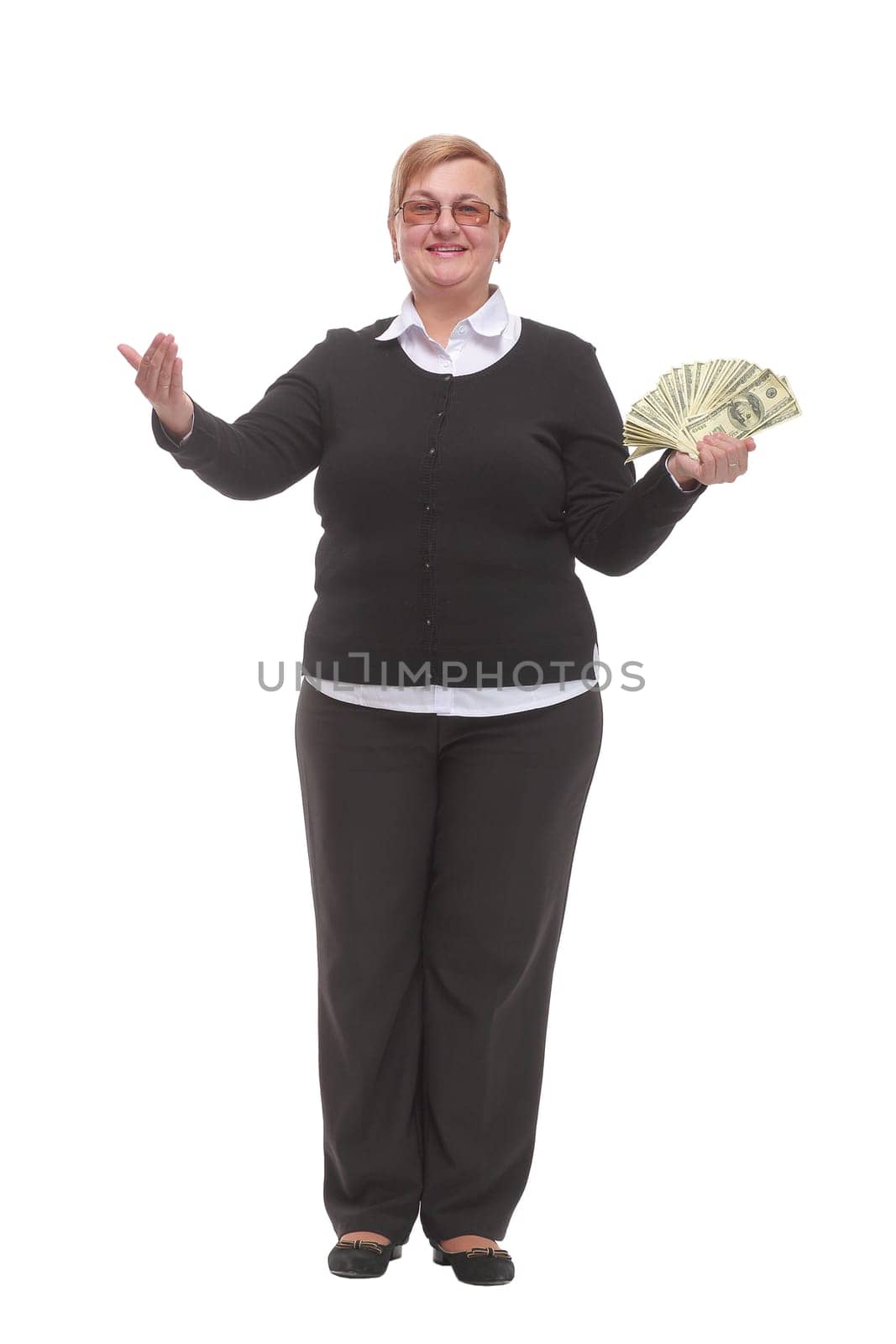 Mature lady holding a bunch of 100-dollar bills with happy facial expression and smiling at camera