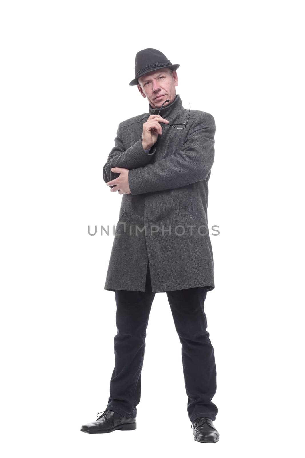 in full growth. intelligent man in a hat and autumn coat. isolated on a white background.