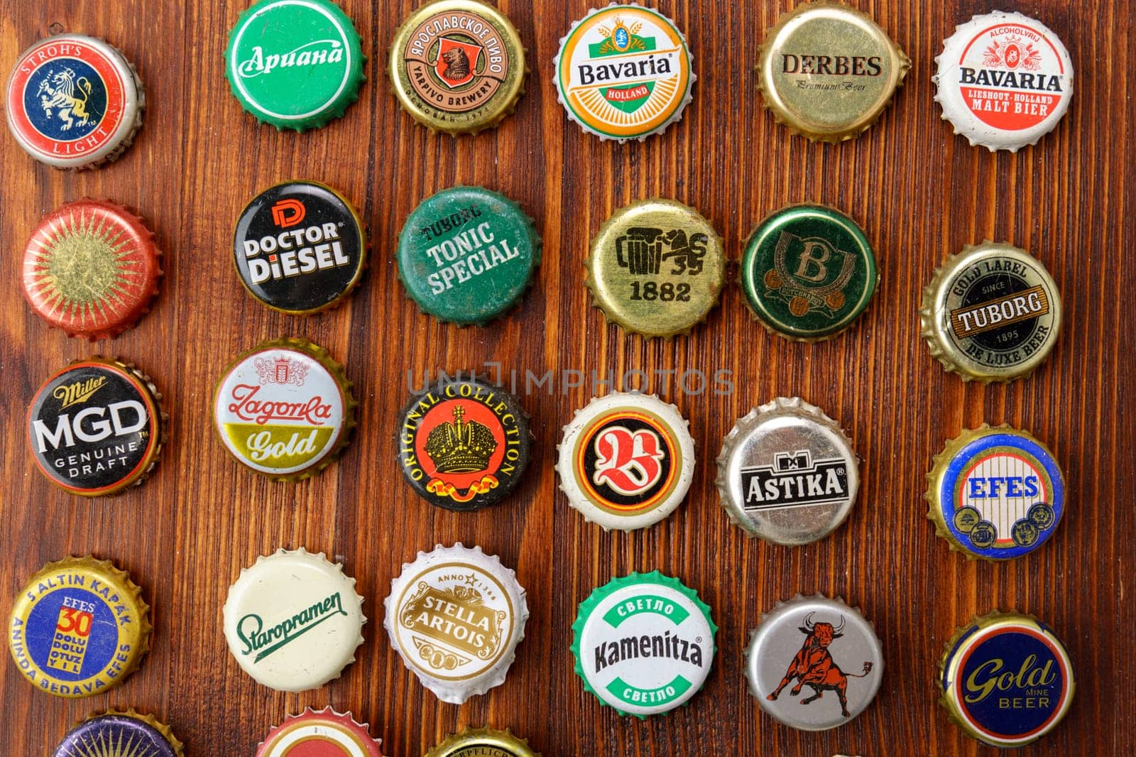 Tyumen, Russia-February 15, 2023: Set of beer caps. A mix of various beer bottle caps