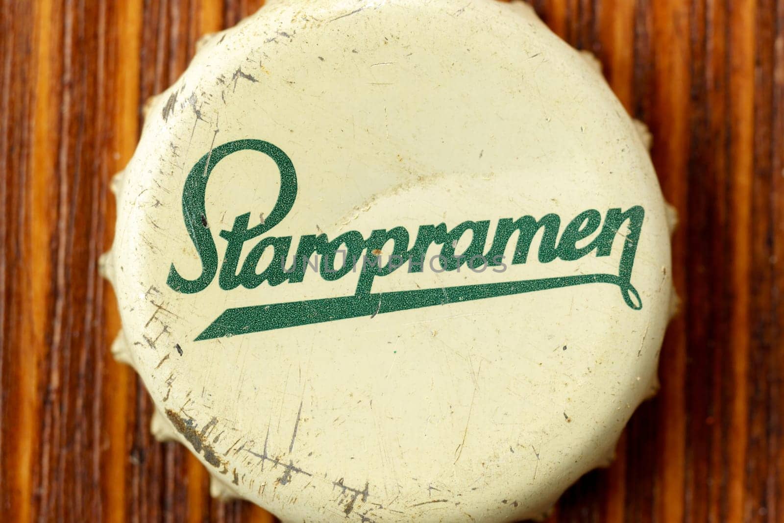 Tyumen, Russia-February 15, 2023: Staropramen is the flagship product of Staropramen Brewery, Czech Republic. Old beer lid, logo