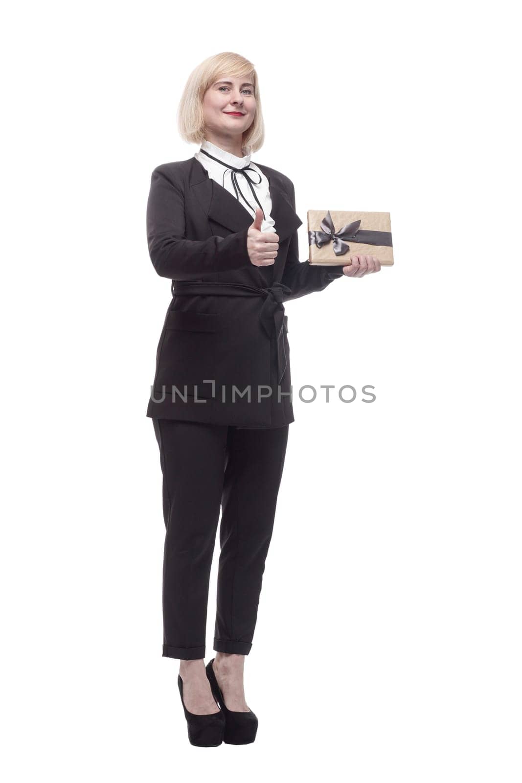 in full growth. attractive business woman with a gift box. isolated on a white background.