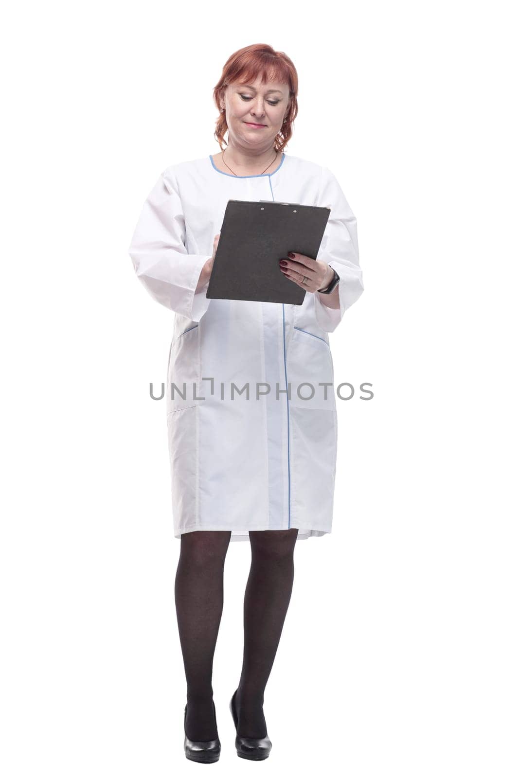 in full growth. competent female doctor with clipboard . isolated on a white background.