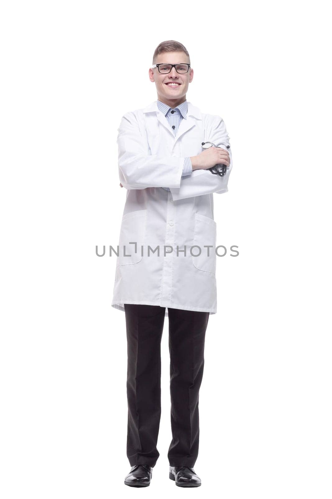 in full growth. stethoscope in the hands of a young doctor. isolated on a white background.