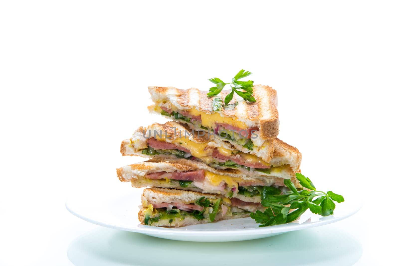 fried toasts stuffed with sausage, cheese and greens inside, isolated on white background.
