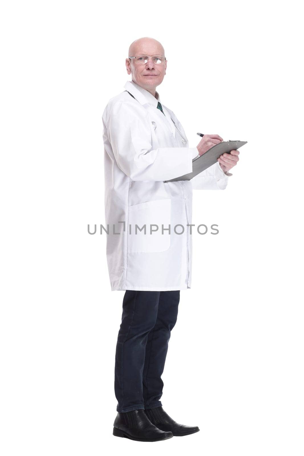 in full growth. male doctor writing a prescription for a patient. isolated on a white background.