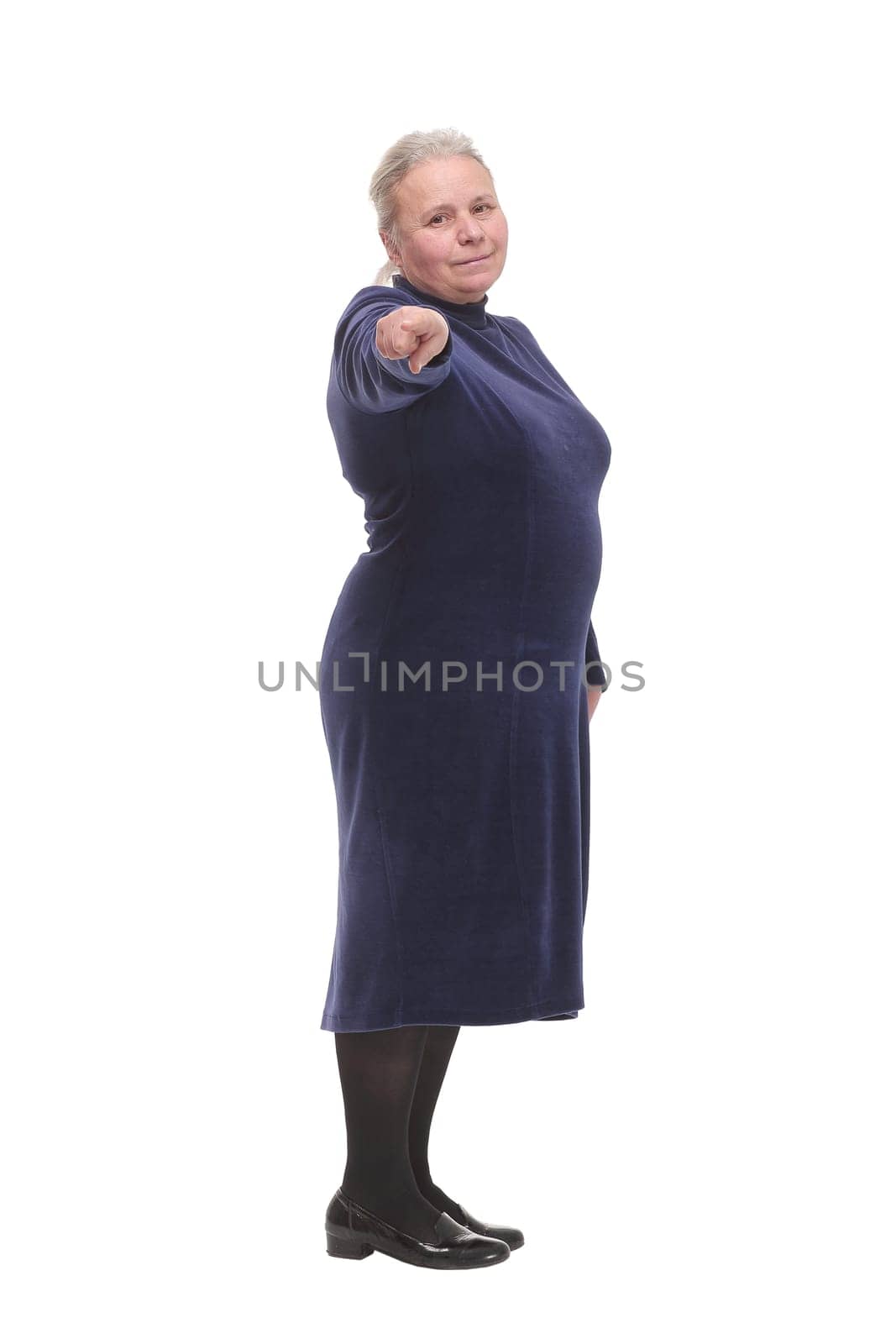 Senior mature woman standing over white isolated background pointing with hand and finger up to the camera with happy and natural expression