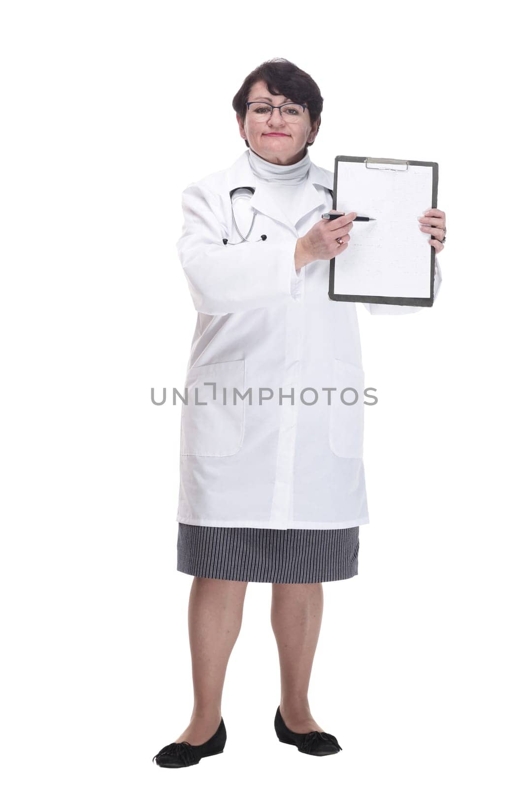 in full growth. senior female doctor with a clipboard. isolated on a white background.