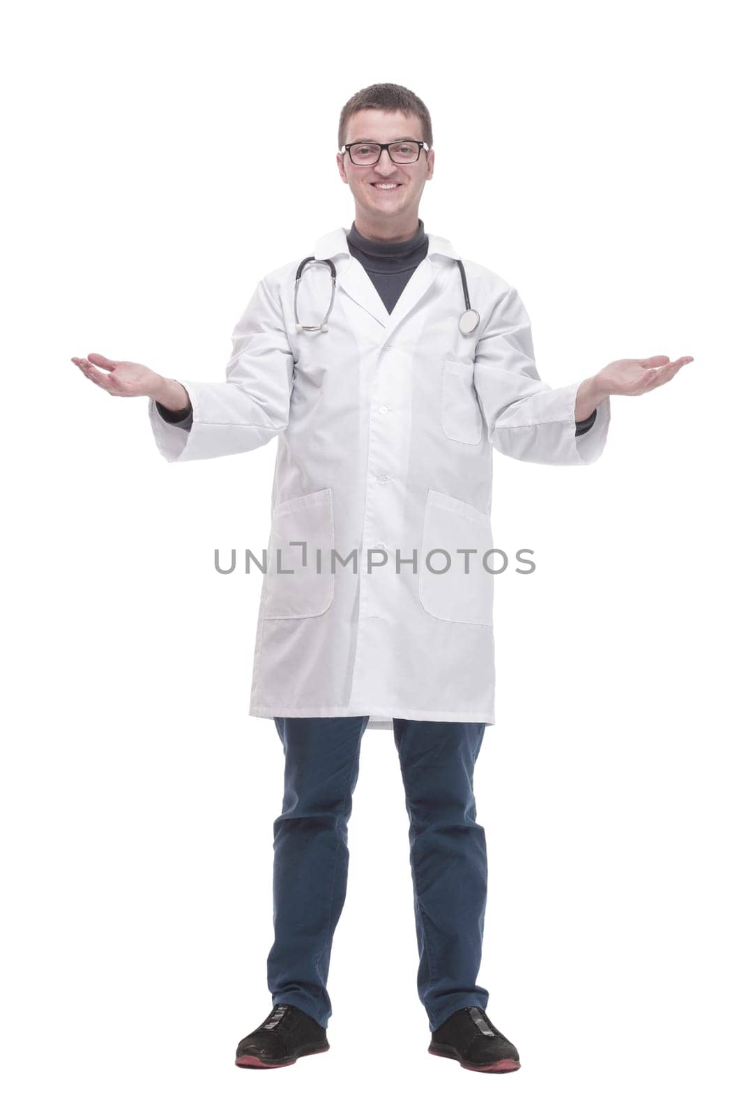 in full growth. qualified doctor with a stethoscope . isolated on a white background.