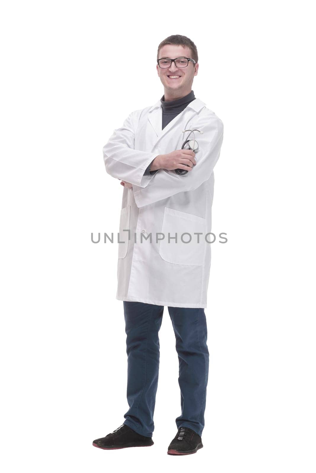 in full growth. confident male doctor with a stethoscope . isolated on a white background.