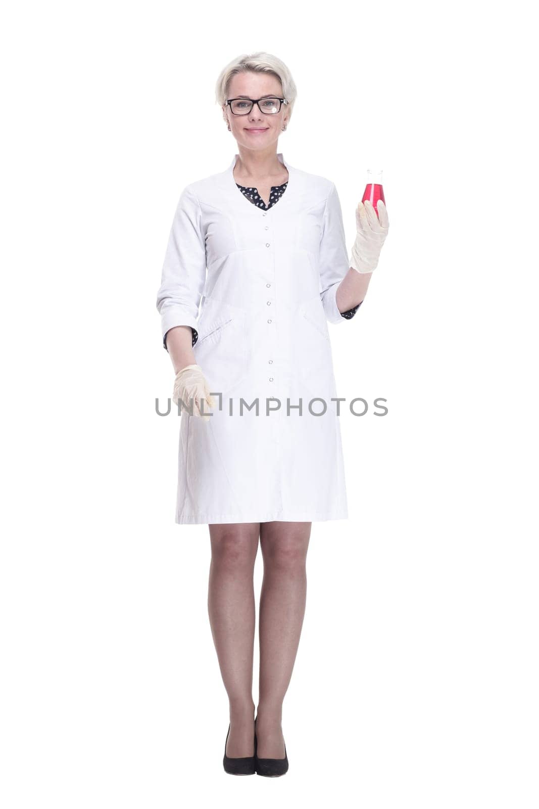 in full growth. female scientist with a laboratory flask looking forward . isolated on a white background.