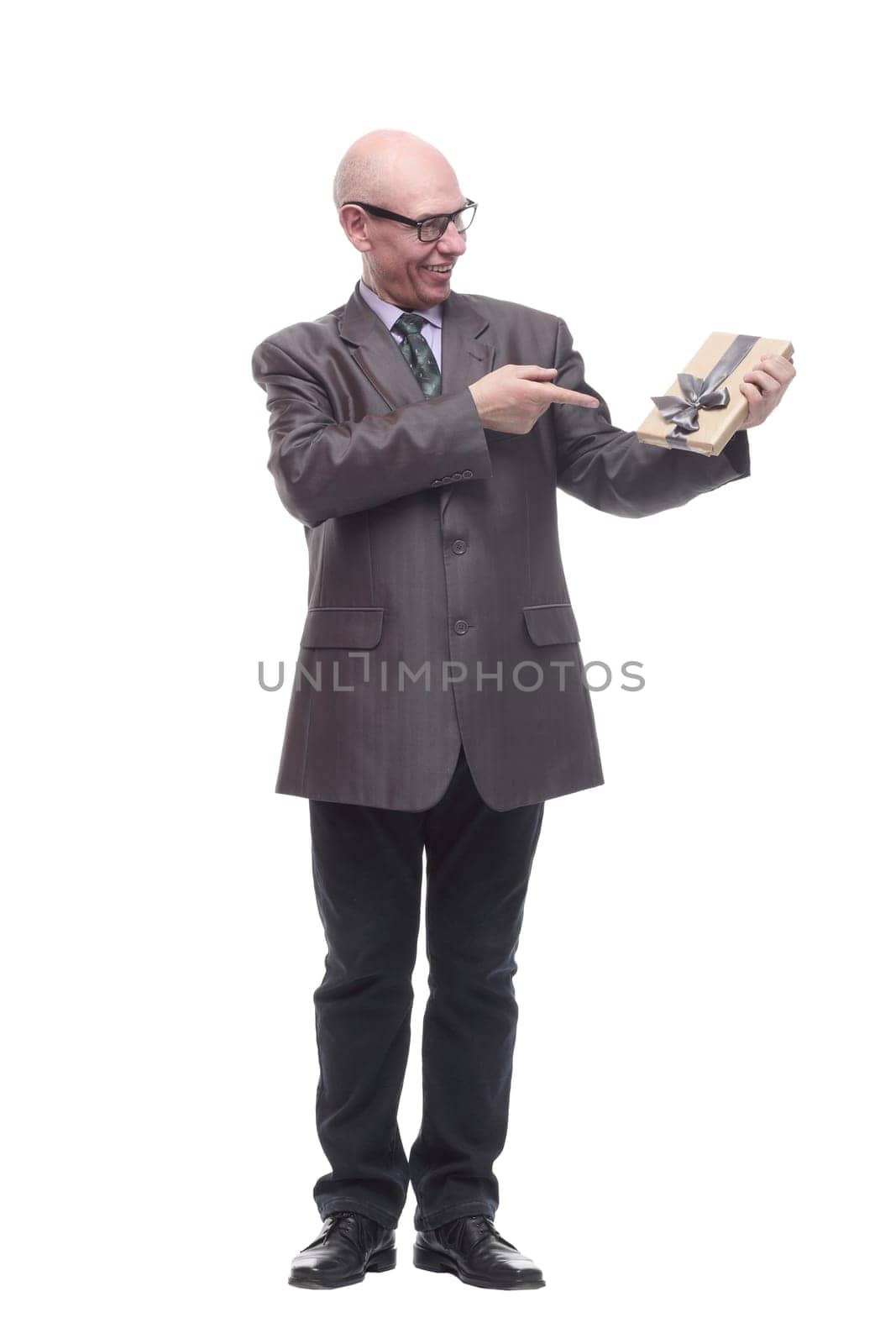 in full growth.business man with a gift box. isolated on a white background.