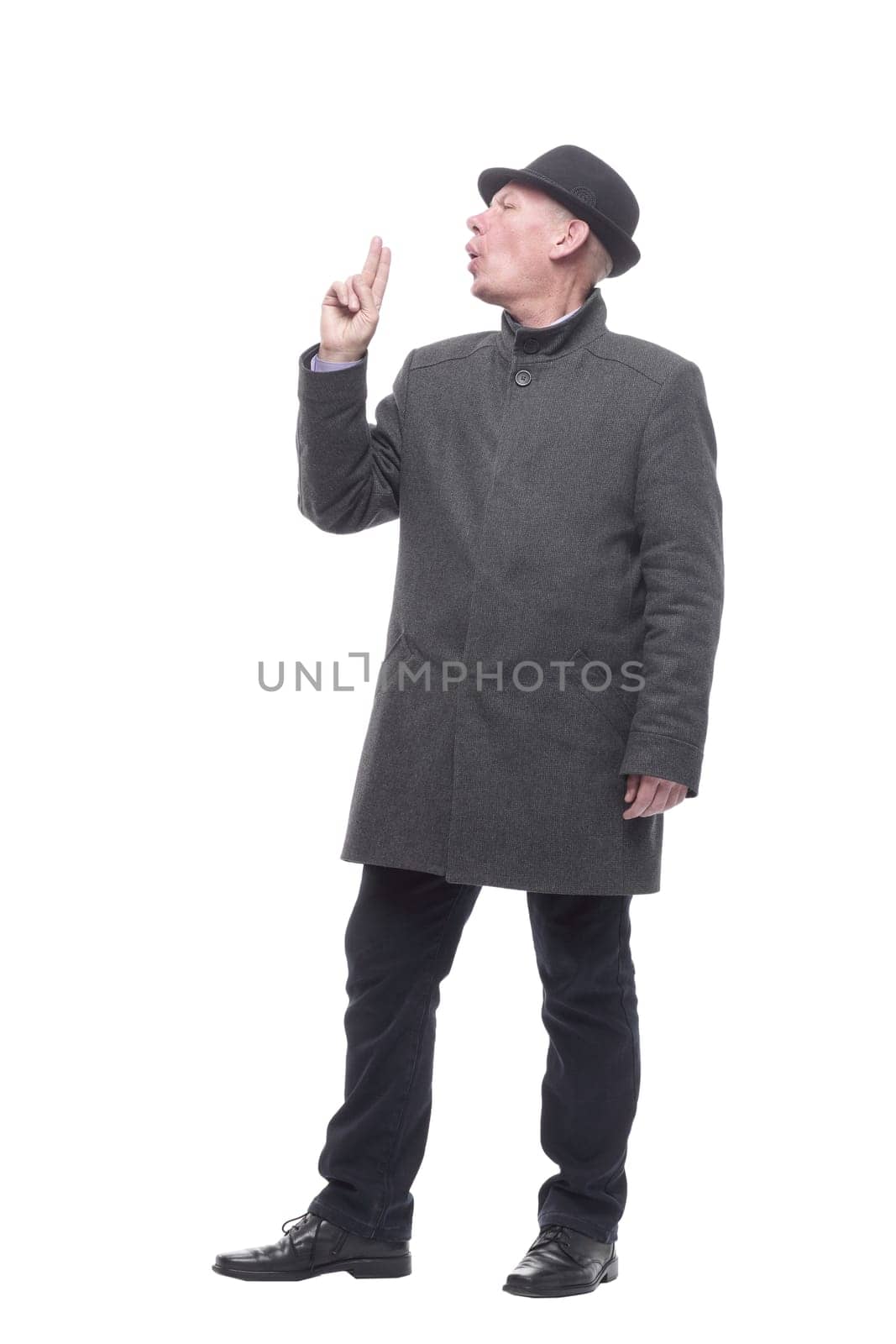 emotional man in a hat and autumn coat . isolated on a white background.