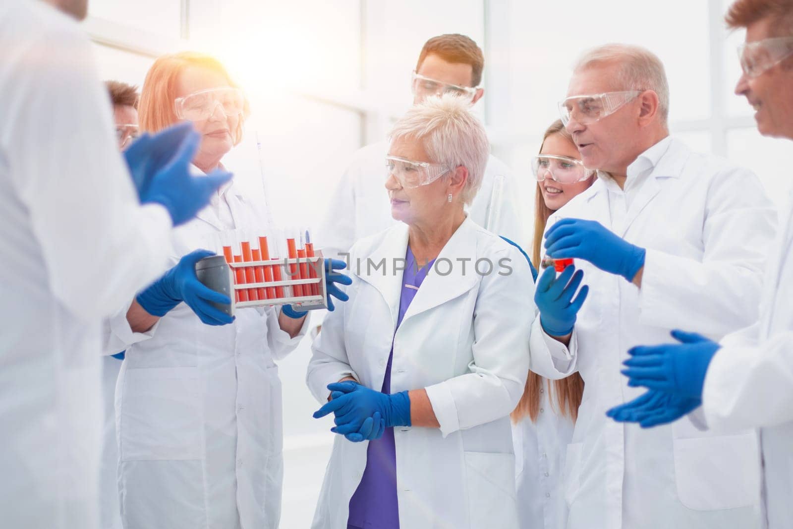 group of medical laboratory employees discussing the results of the study. by asdf