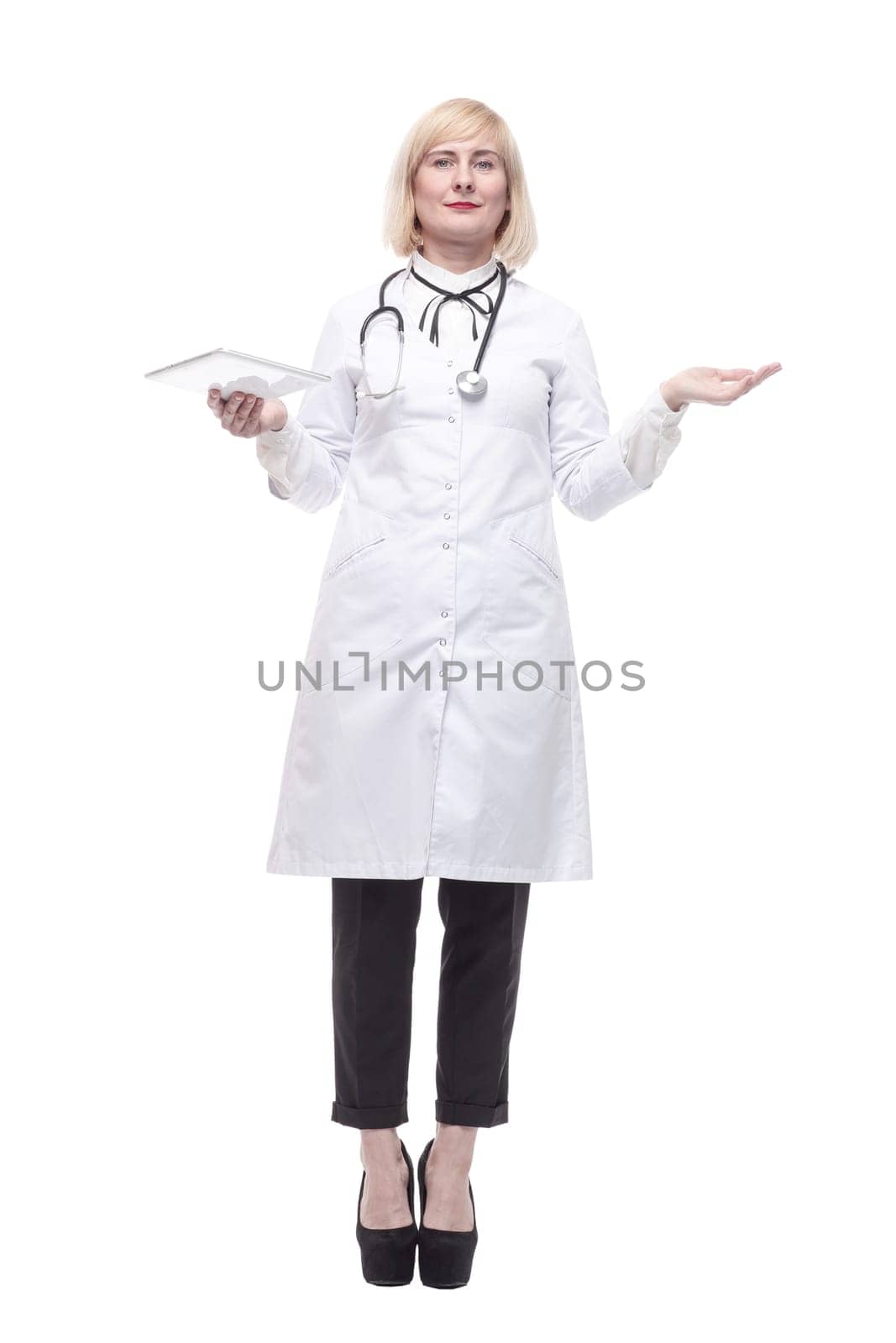 in full growth. qualified female doctor with a digital tablet. isolated on a white background.