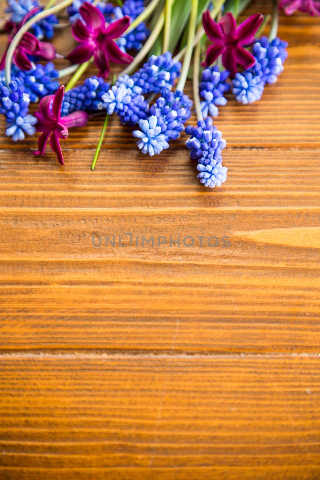beautiful bouquet of spring flowers on a wooden table, rustic style.