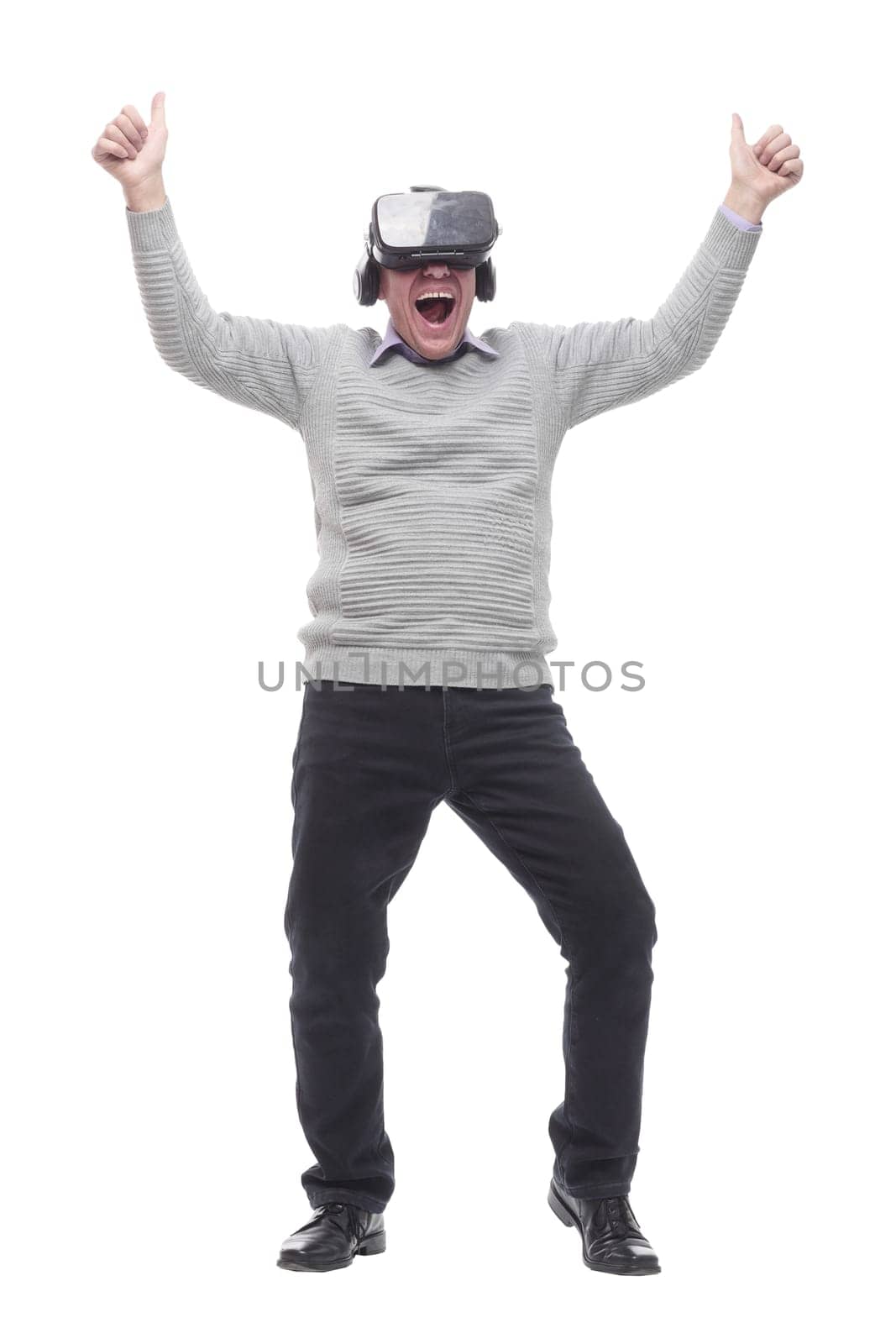 in full growth. smiling man in virtual reality glasses. isolated on a white background.