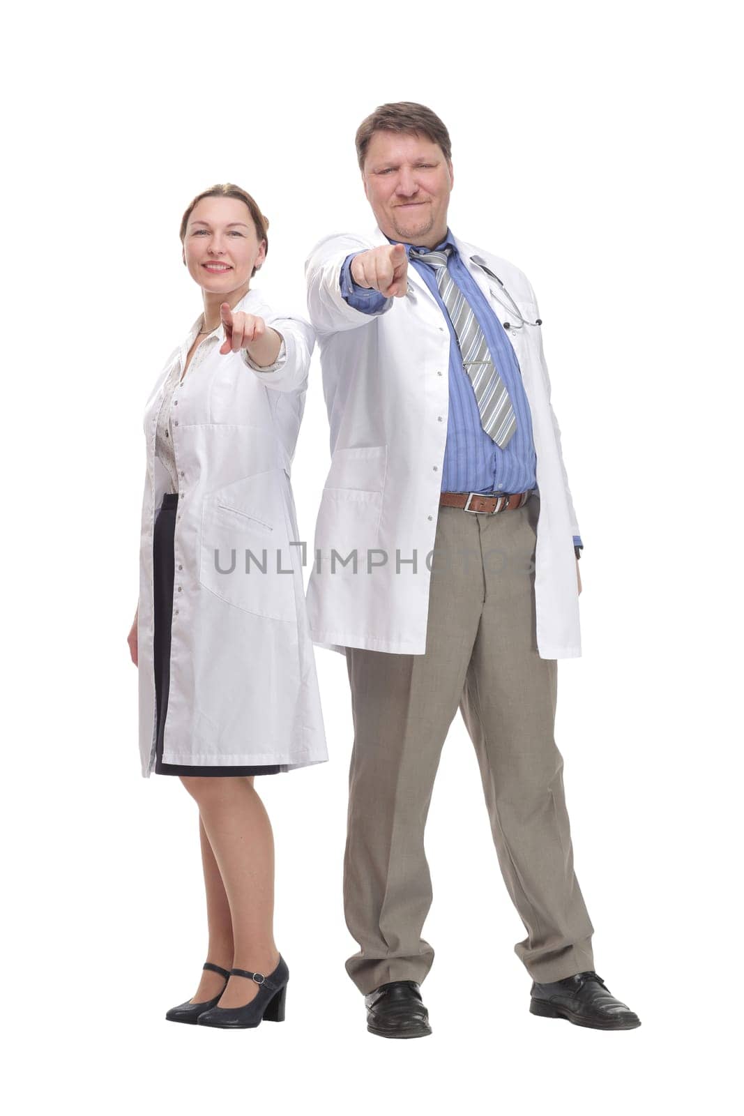 in full growth. medical colleagues standing together.isolated on a white background.