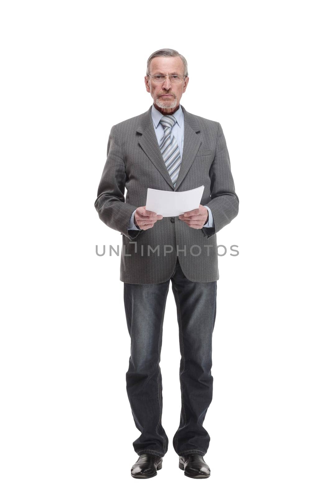 Full length portrait of a mature businessman looking at documents isolated on white background