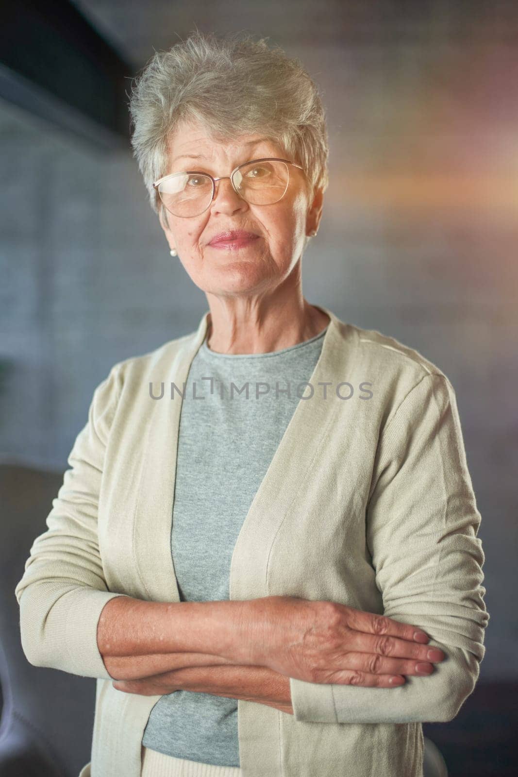 Close up portrait of beautiful senior woman posing at home